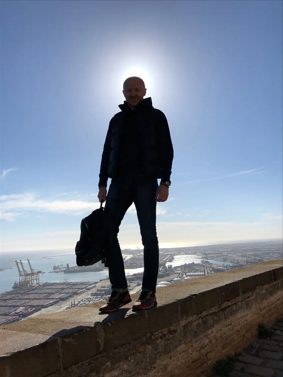 Silhouette of a person against Barcelona skyline