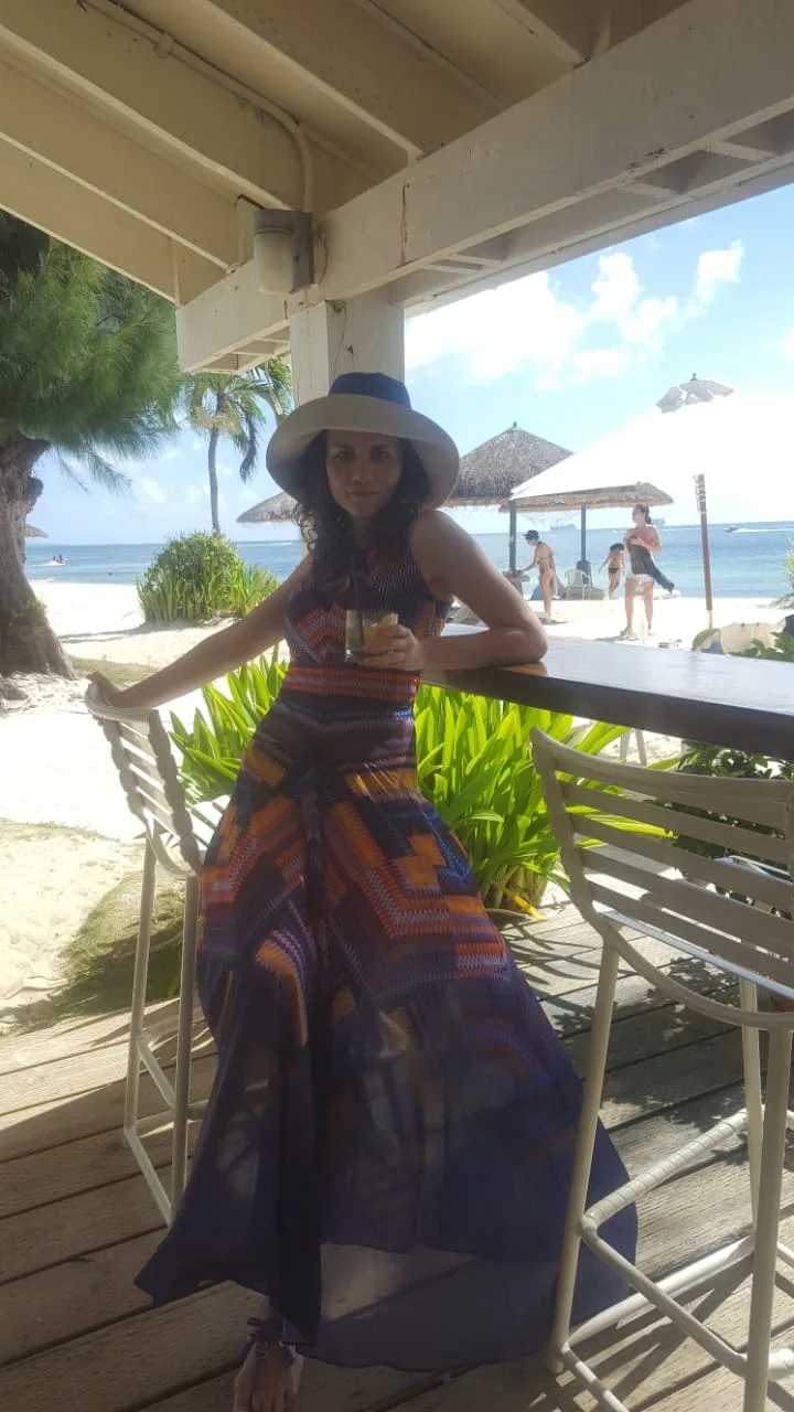 Girl in a café by the beach in Saipan
