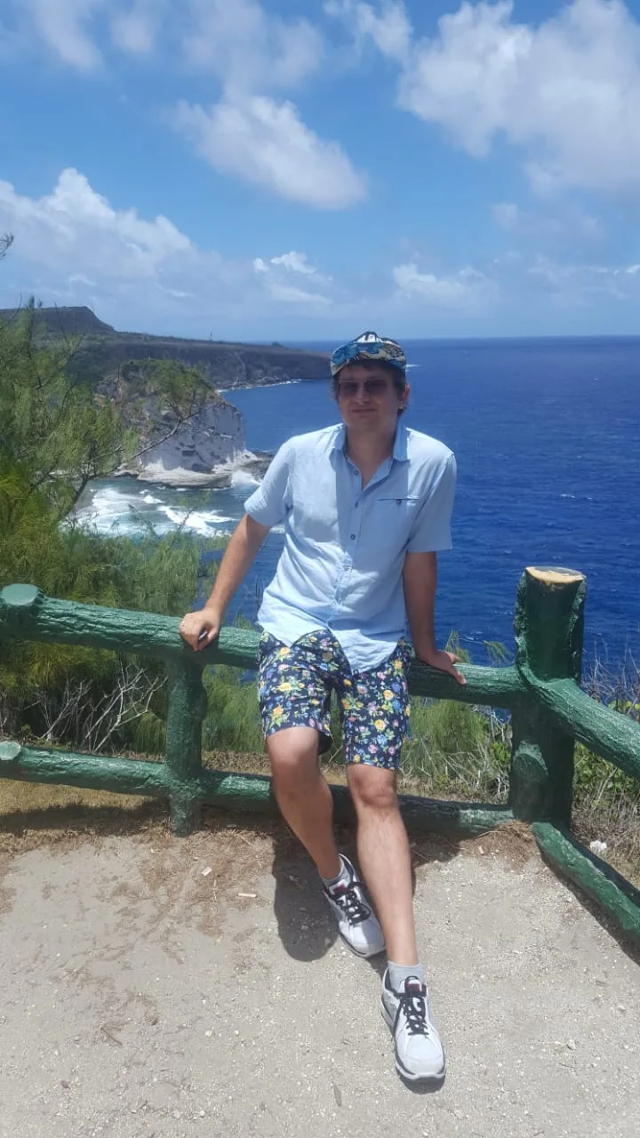 Tourist by cliffs with a sea view, Saipan