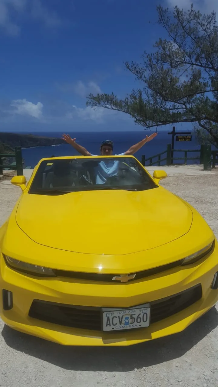 Yellow convertible on Saipan road