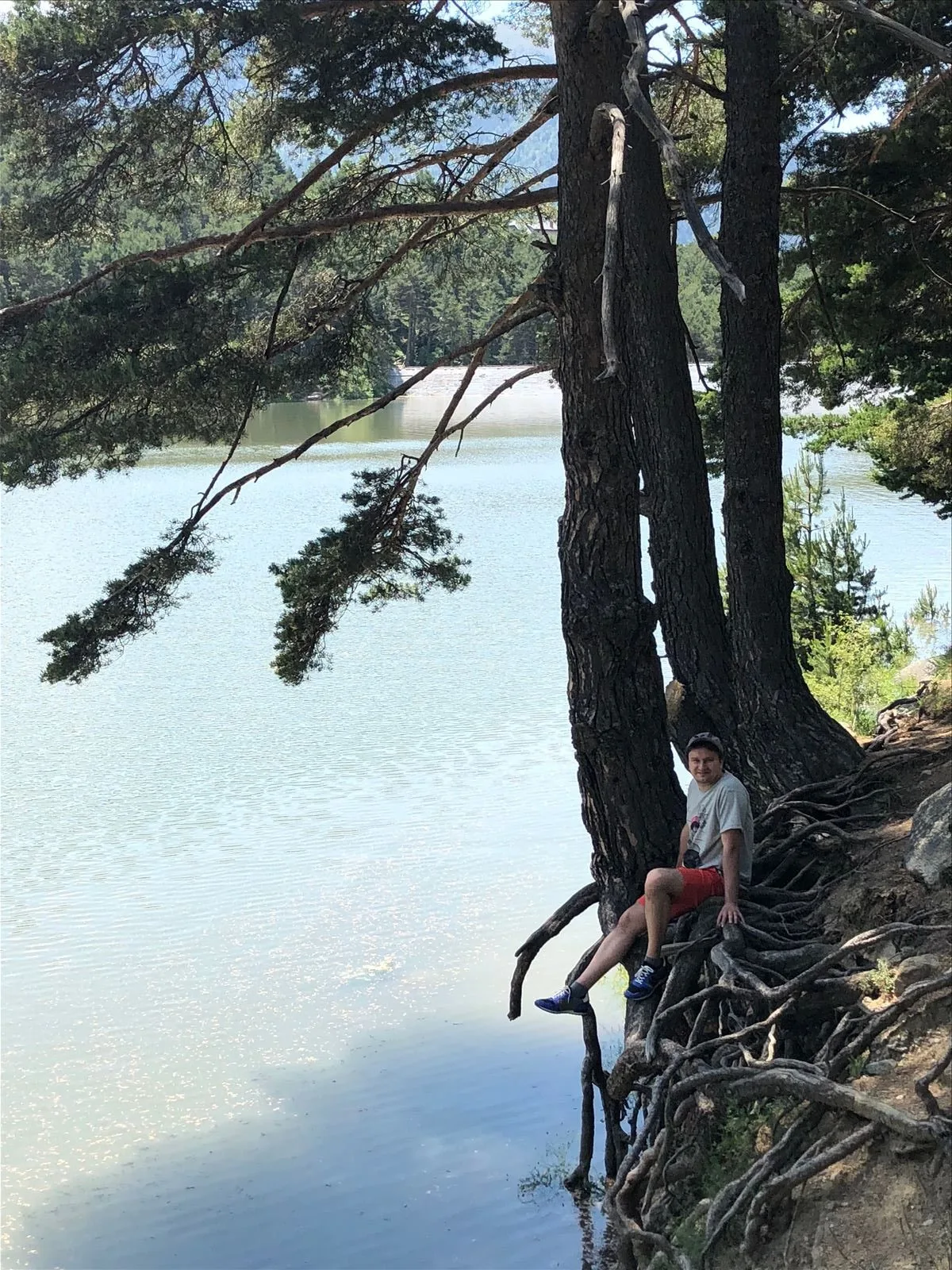 Lake in the Andorran mountains with a tourist