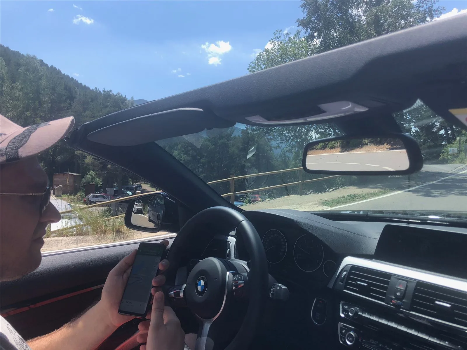 View from the car cabin on the road in Andorra