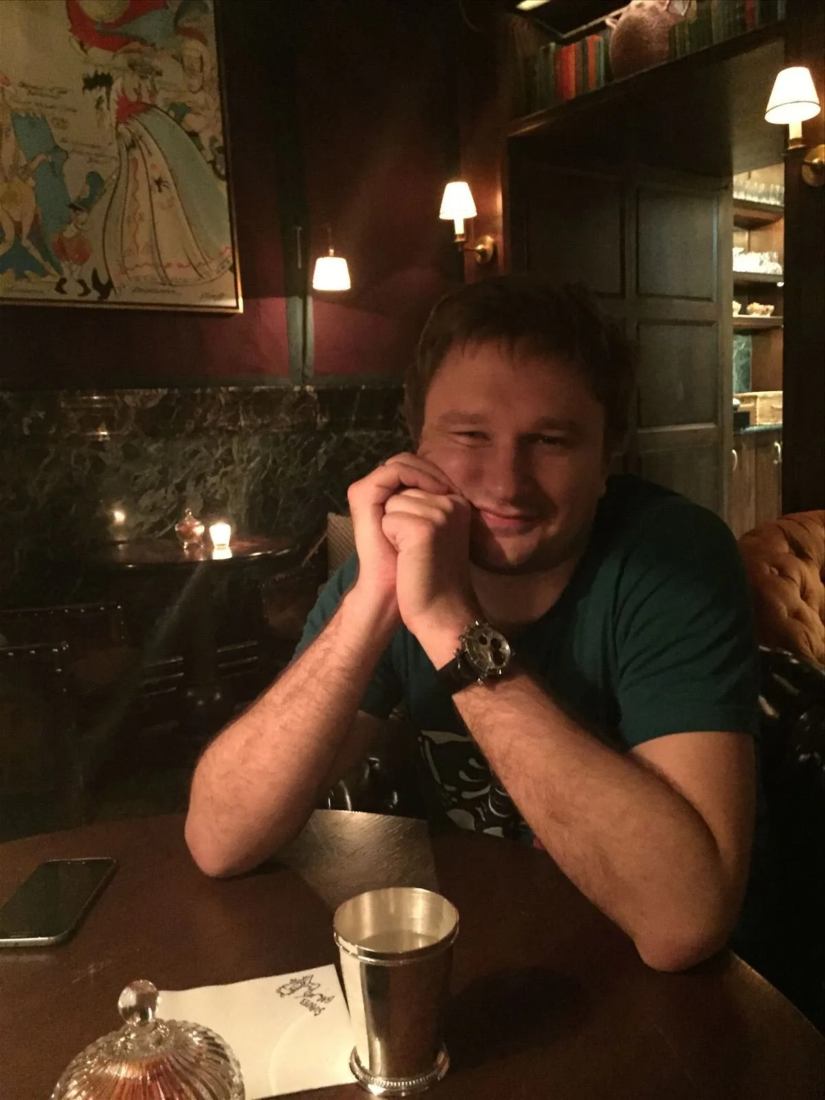 Young man at table in London pub