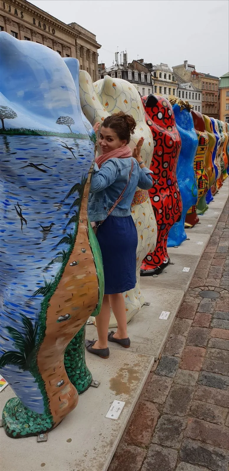 Street artist with colorful canvas, Riga
