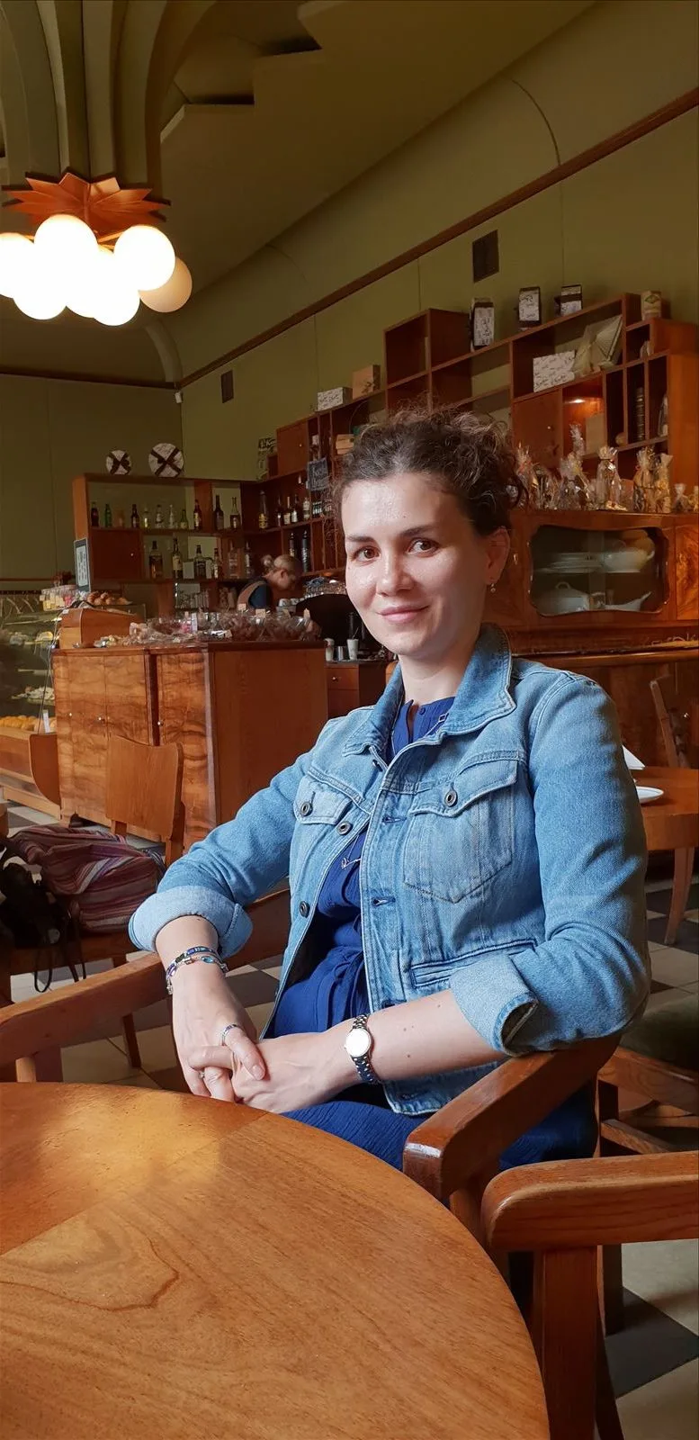 Girl sitting in a cozy café in Riga
