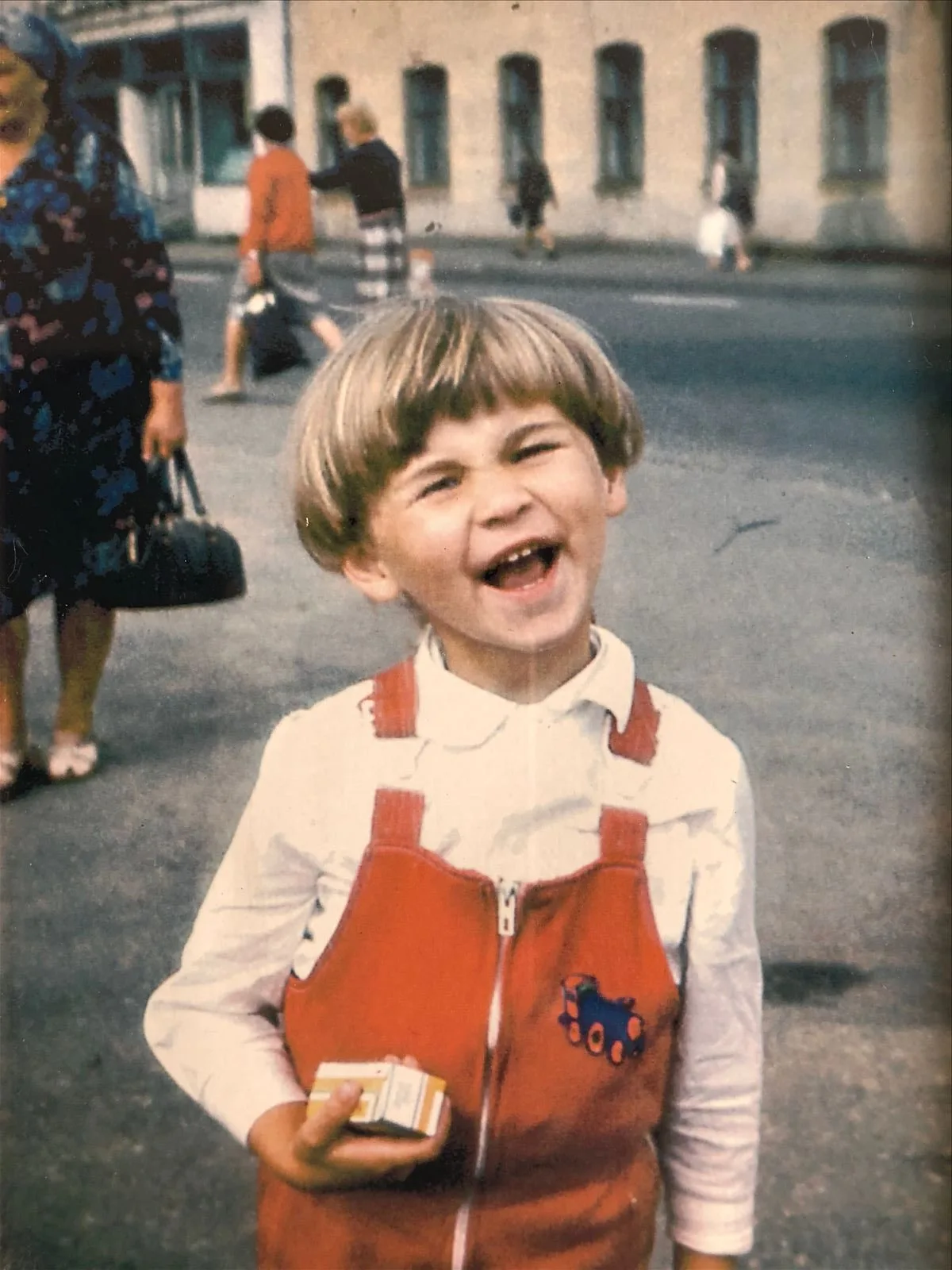 Small child smiling on Riga street