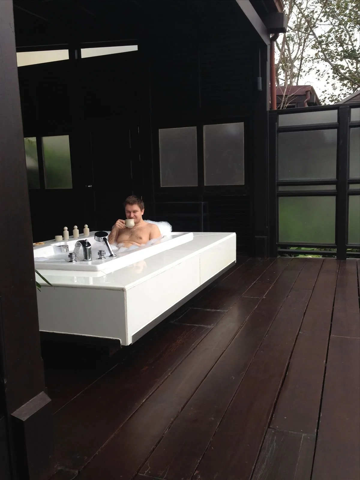 Man in an open bath at a Samui hotel