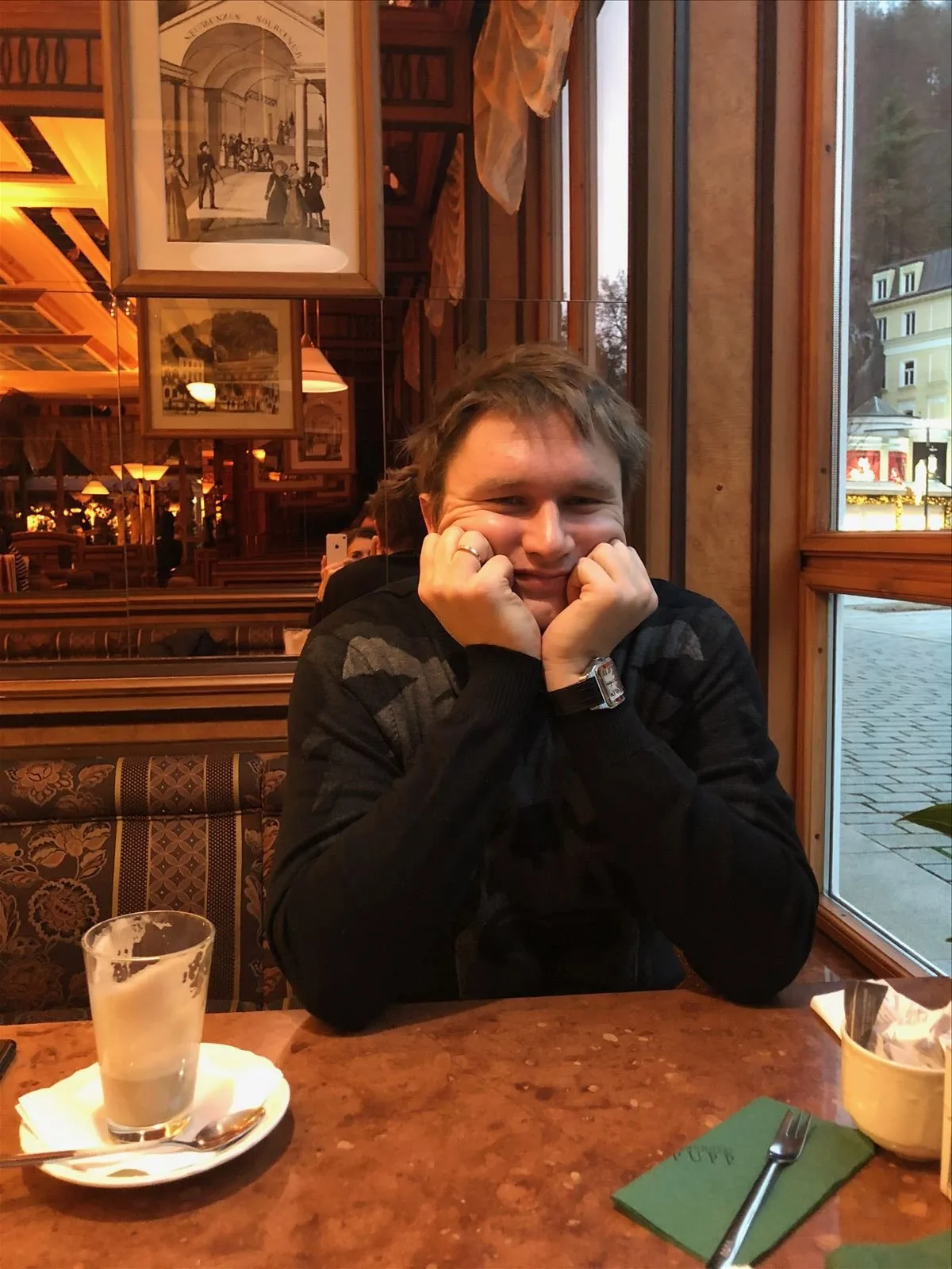 Man at Becherovka café in Karlovy Vary