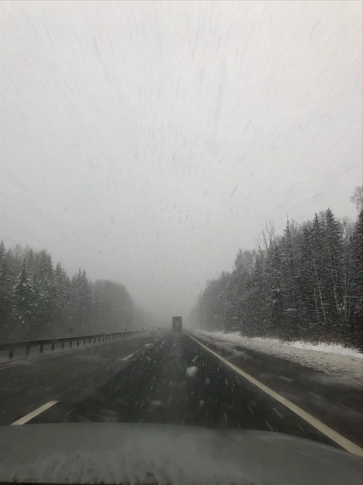 Driving on the highway in a snowstorm