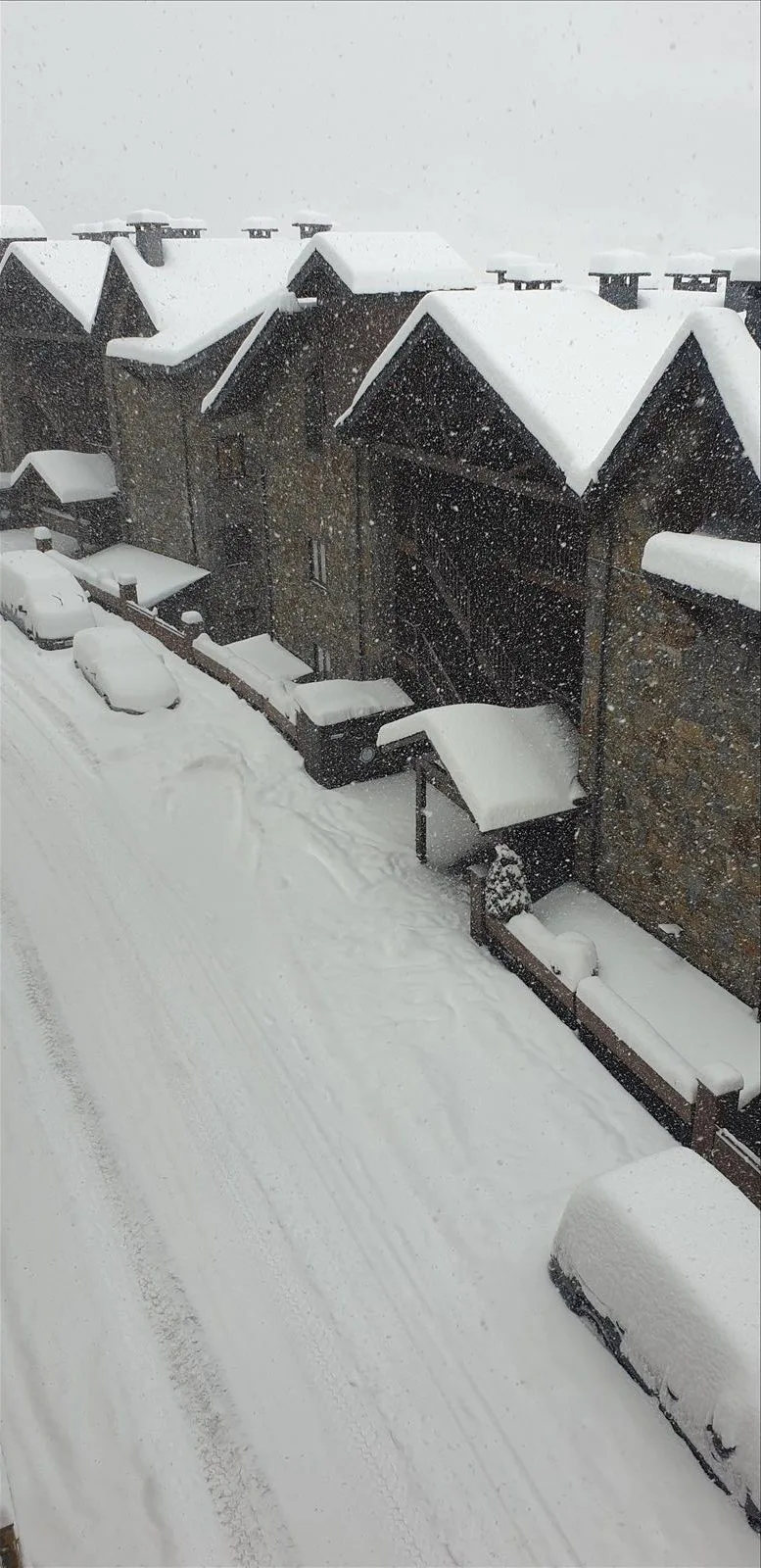 Snow-covered cars after snowfall in Andorra