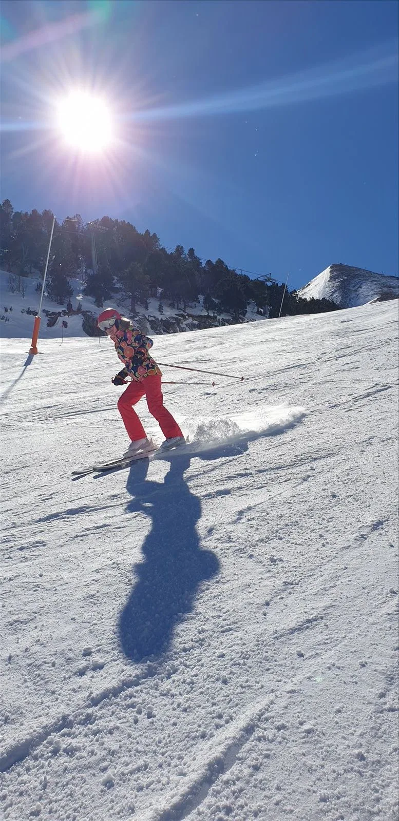 Snowboarder on slope in Andorra