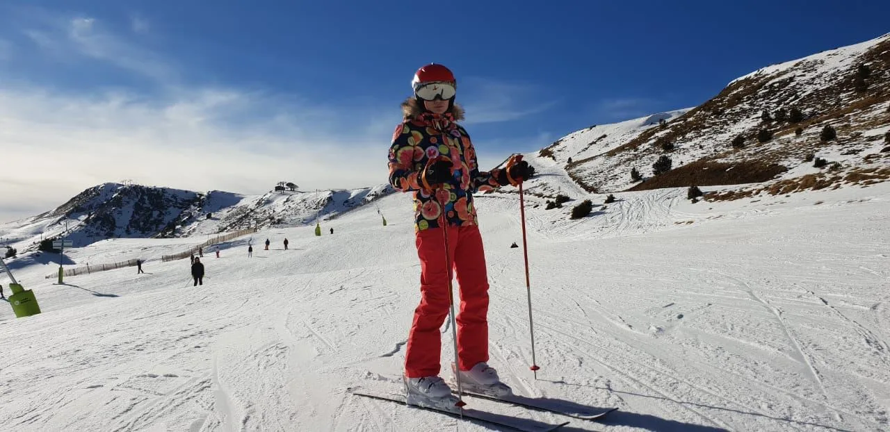 Skier in red on slope in Andorra
