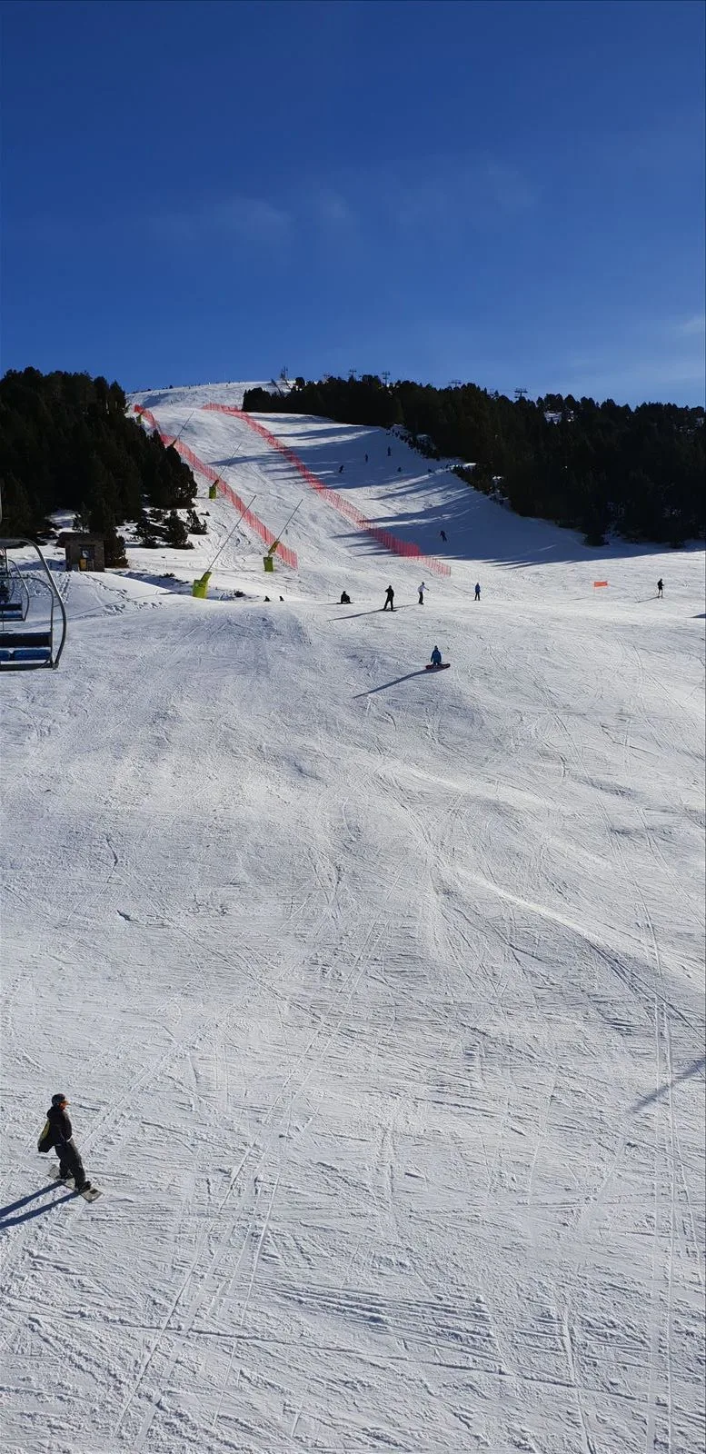 Ski slope with skiers in Andorra