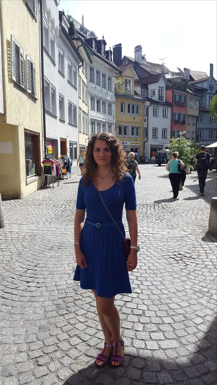 Tourist in a blue dress on the Lindau promenade