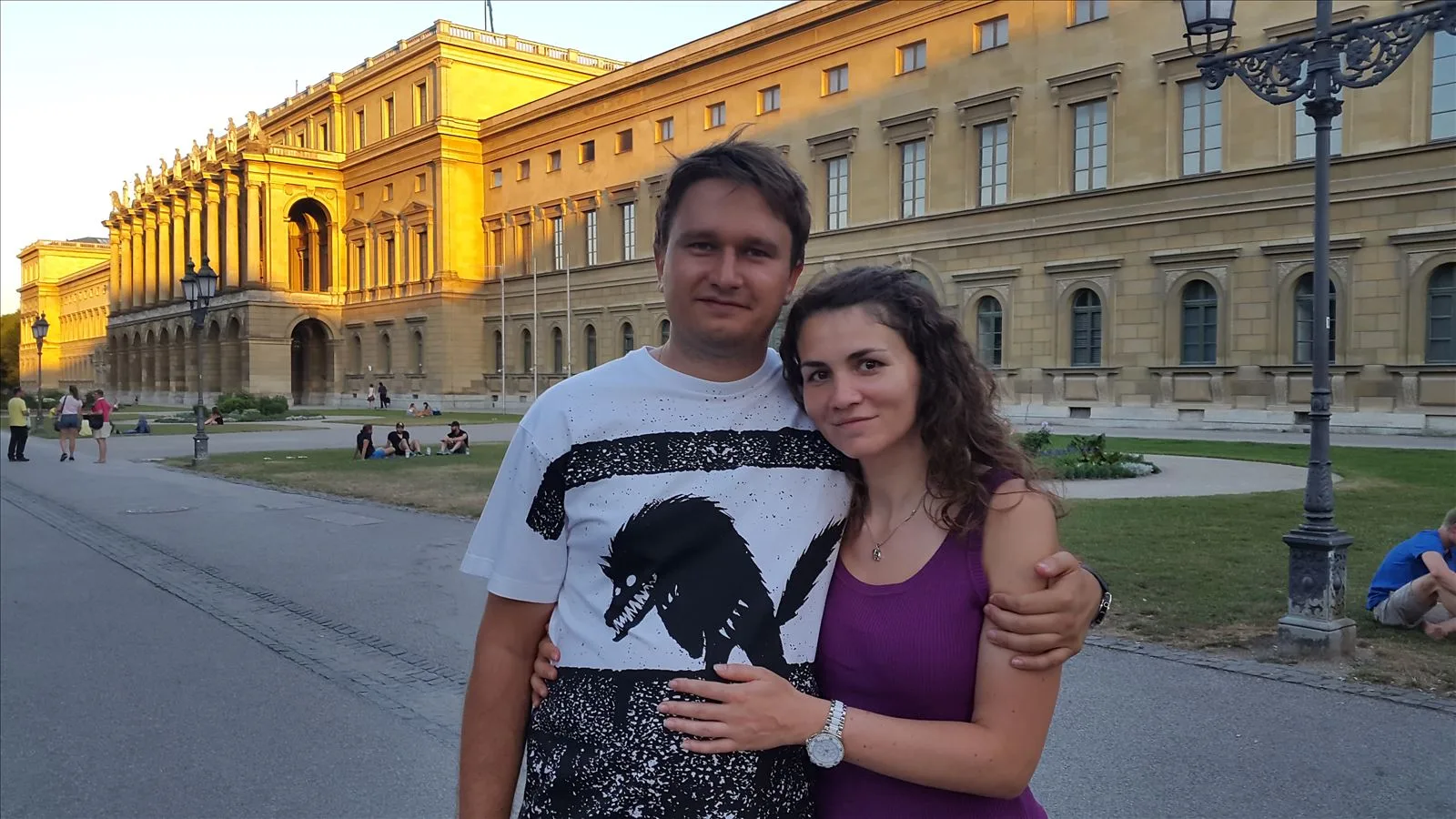 Tourist by a yellow building in central Munich