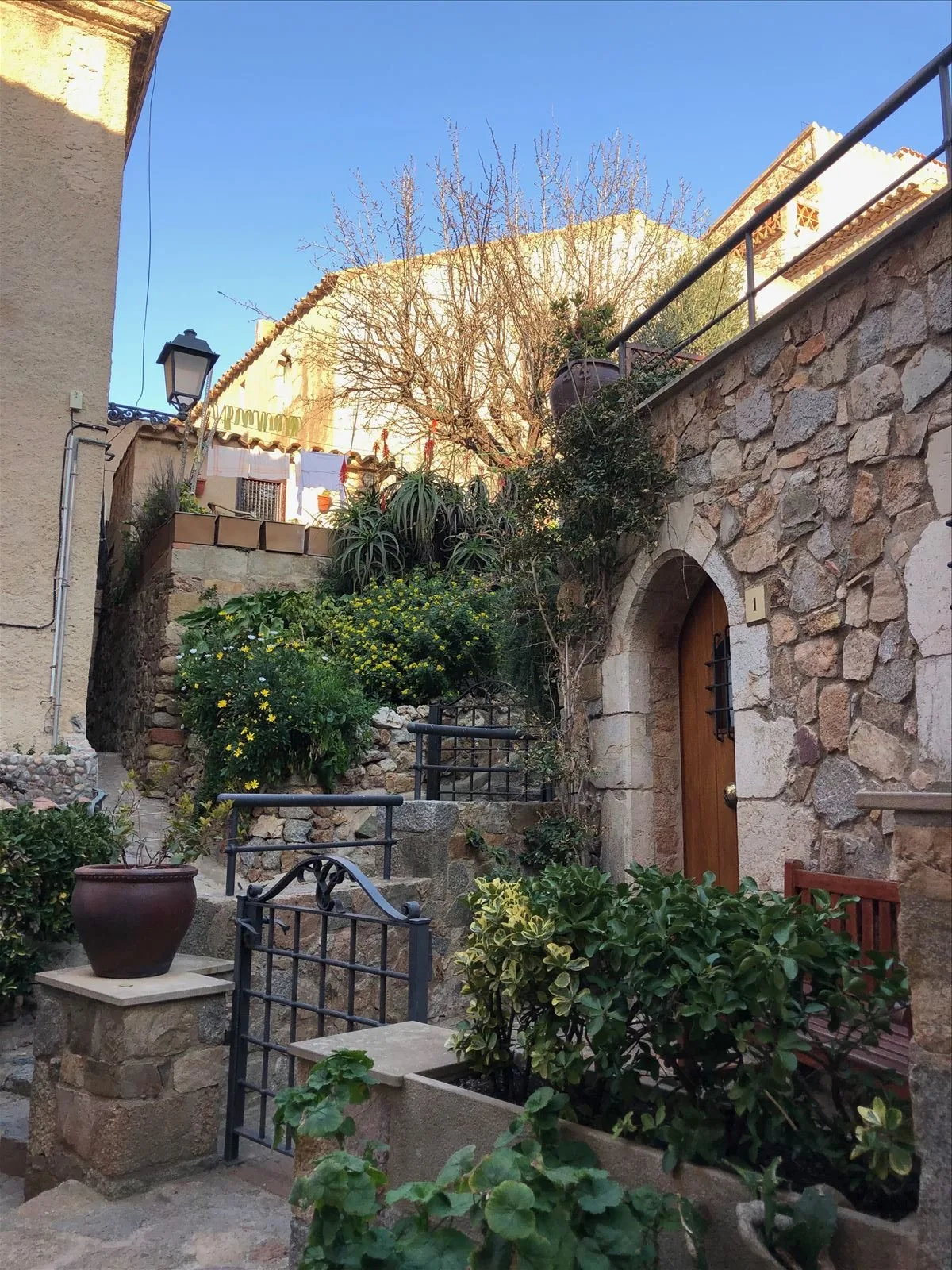 Man on the stone steps of Tossa
