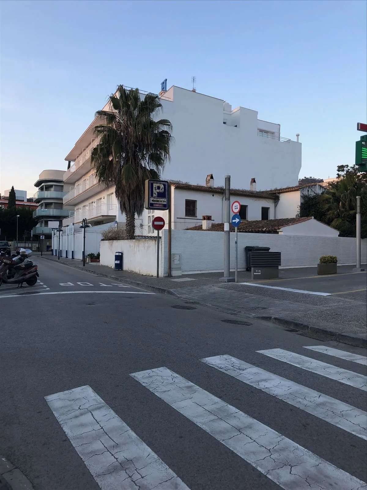 Girl taking a photo on the promenade of Tossa