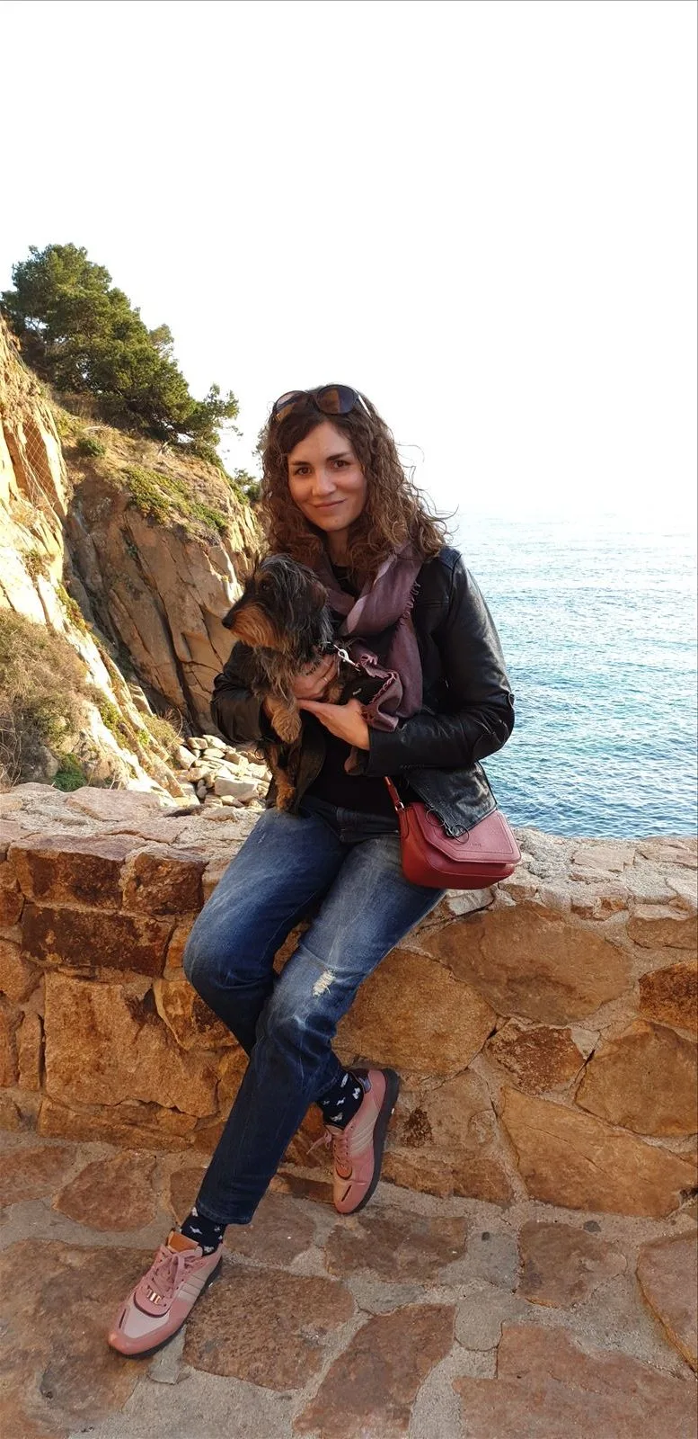 Girl on the cliffs of a fortress by the sea