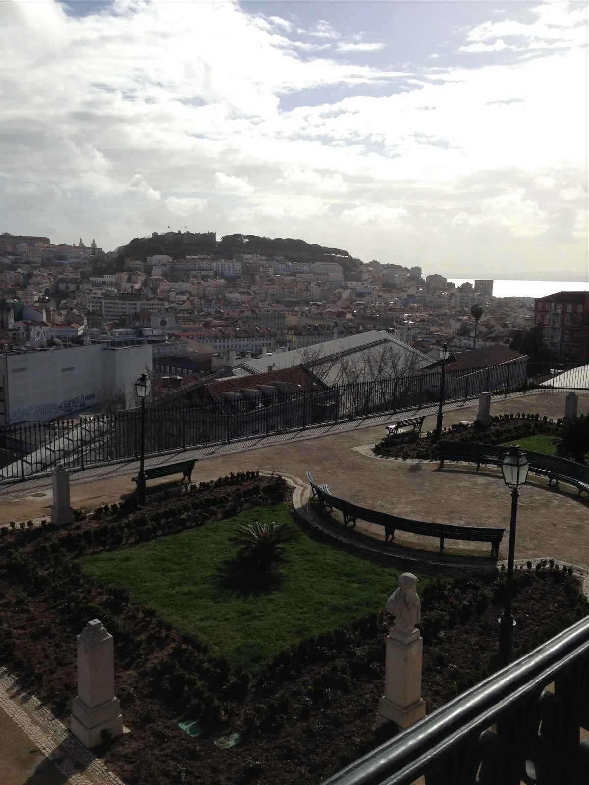 Cascais village with red roofs and the sea