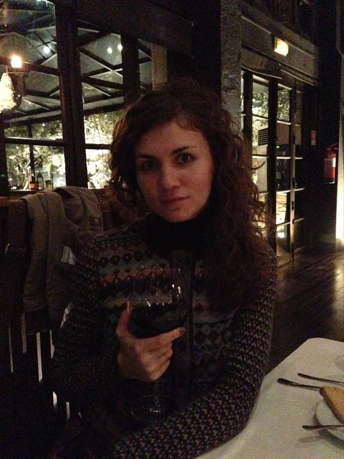 Tourist in a restaurant with a glass of wine