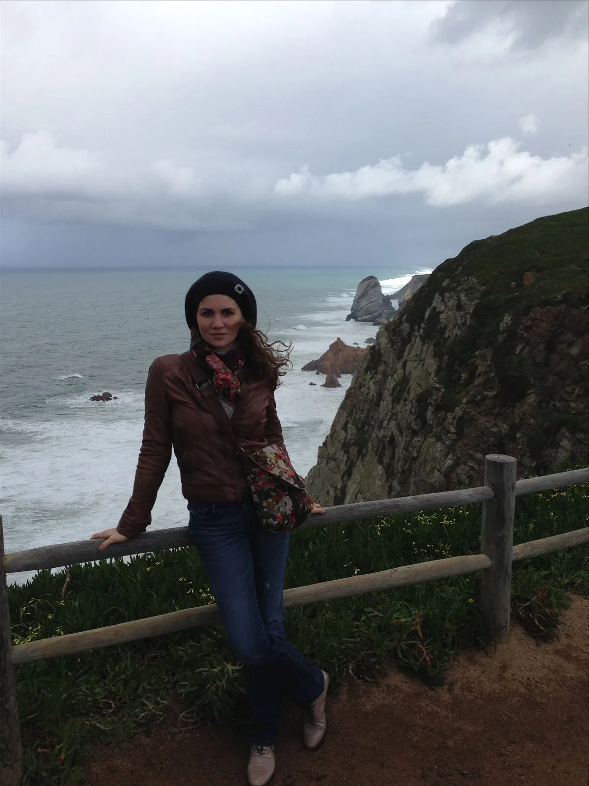 Tourist on the cliffs of Cabo da Roca, Portugal