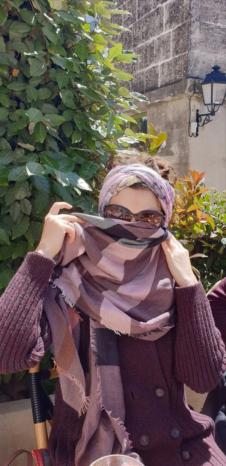 Woman in a scarf in the wind in Nice
