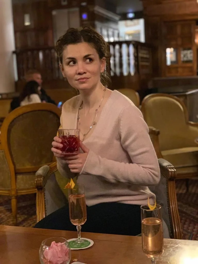 Woman with a glass on restaurant terrace