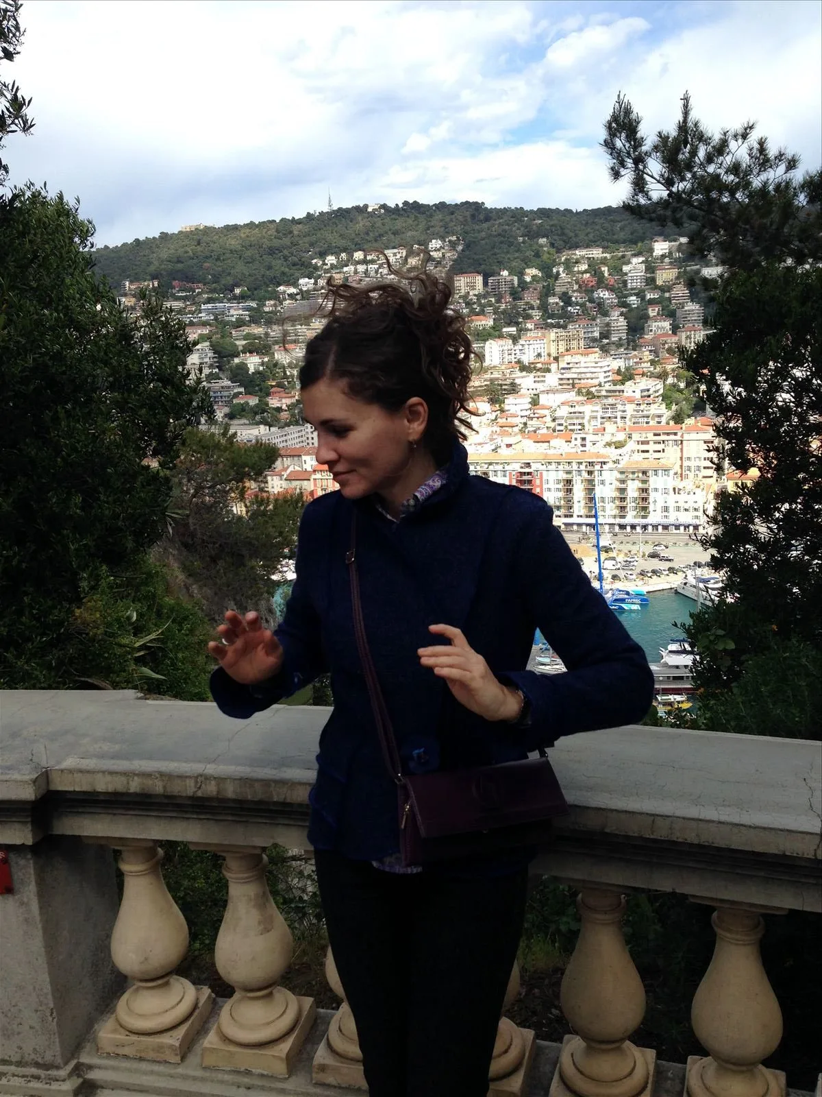 Woman looking at the sea from a hill