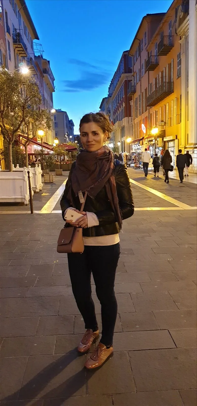 Woman in the Old Town of Nice at night