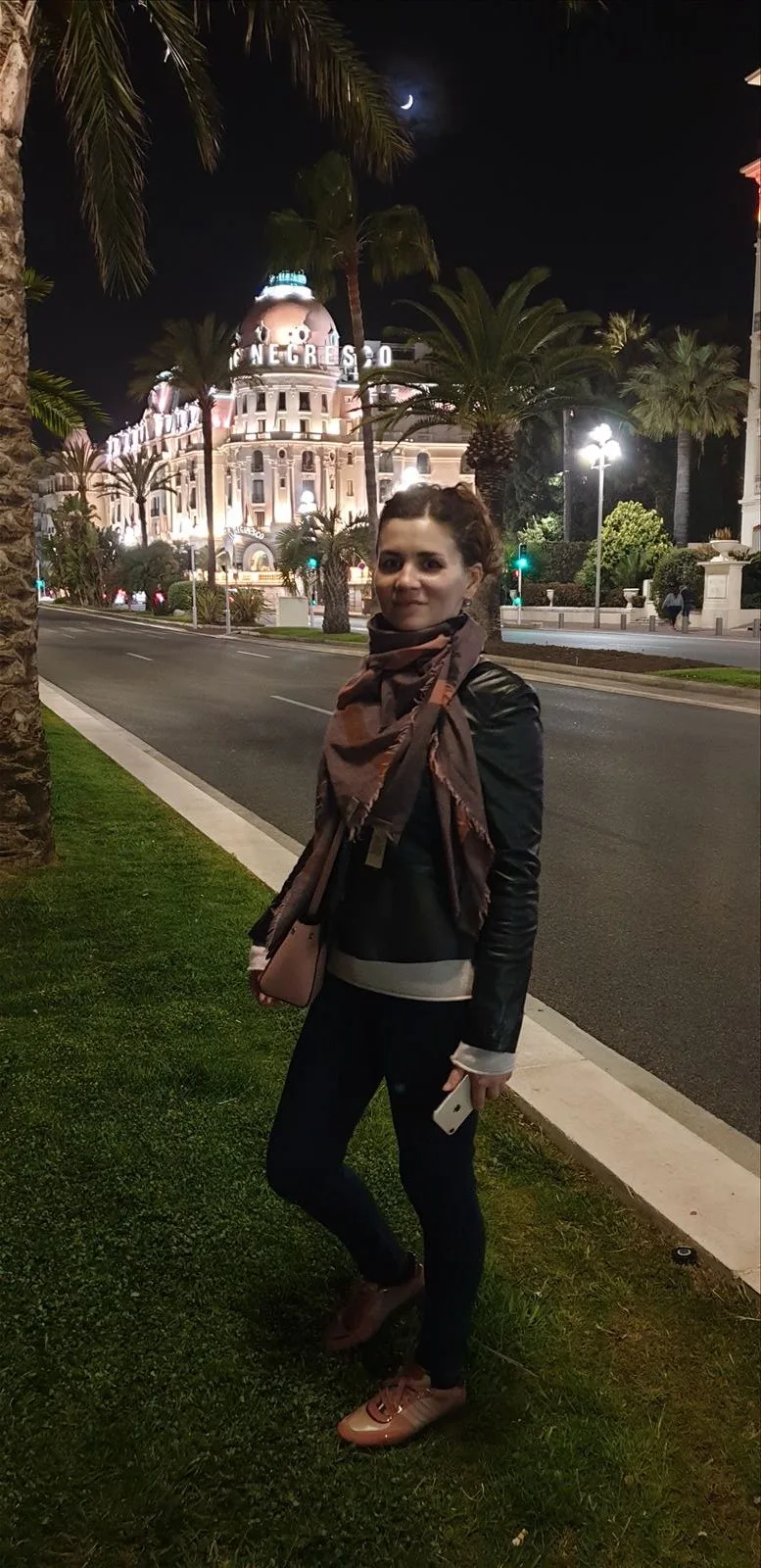 Woman by fountain in Nice park