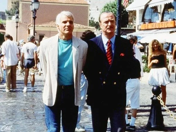 Two men on Boulé-sur-Mer street