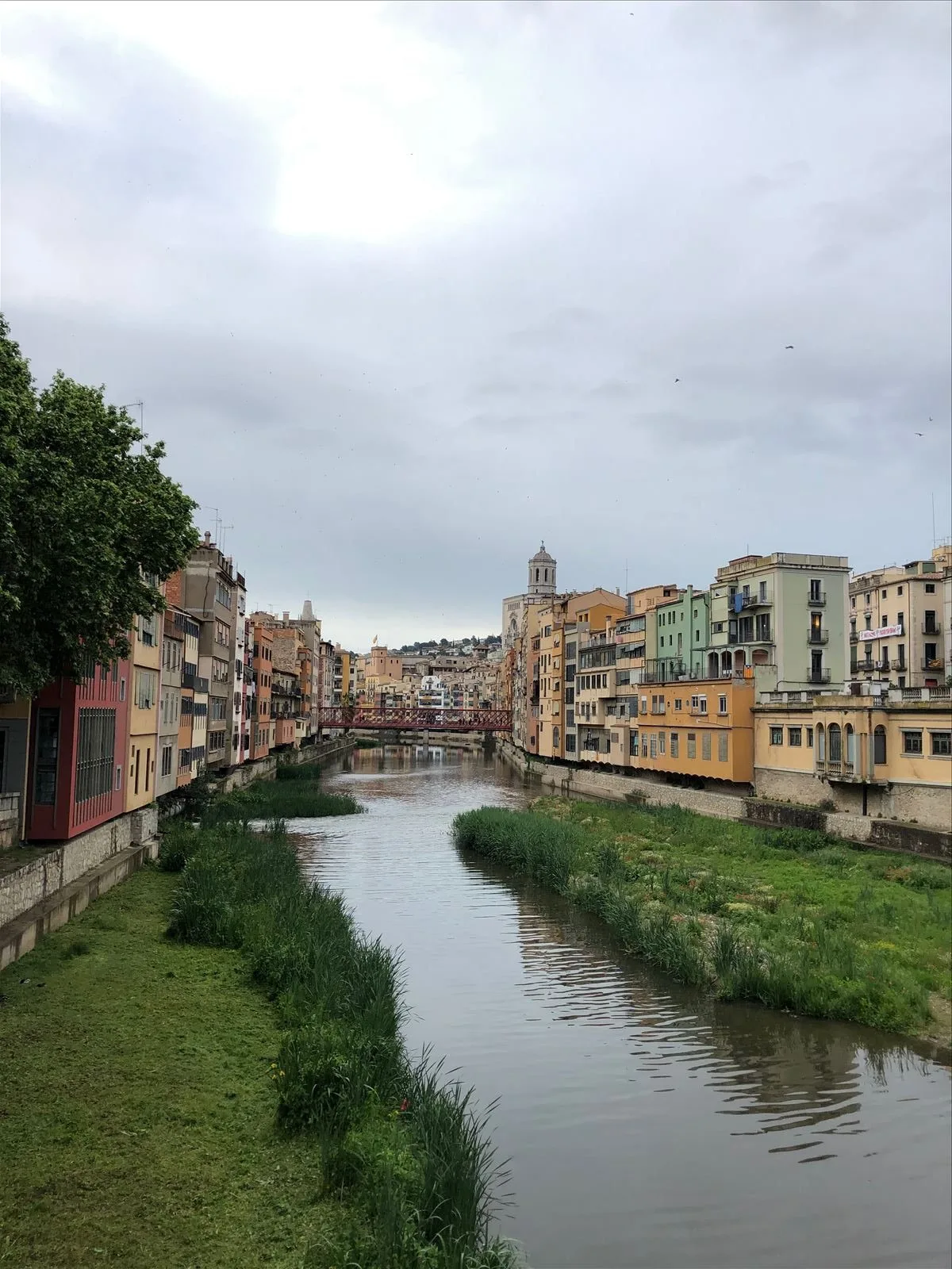 Colorful houses of Girona with tower view