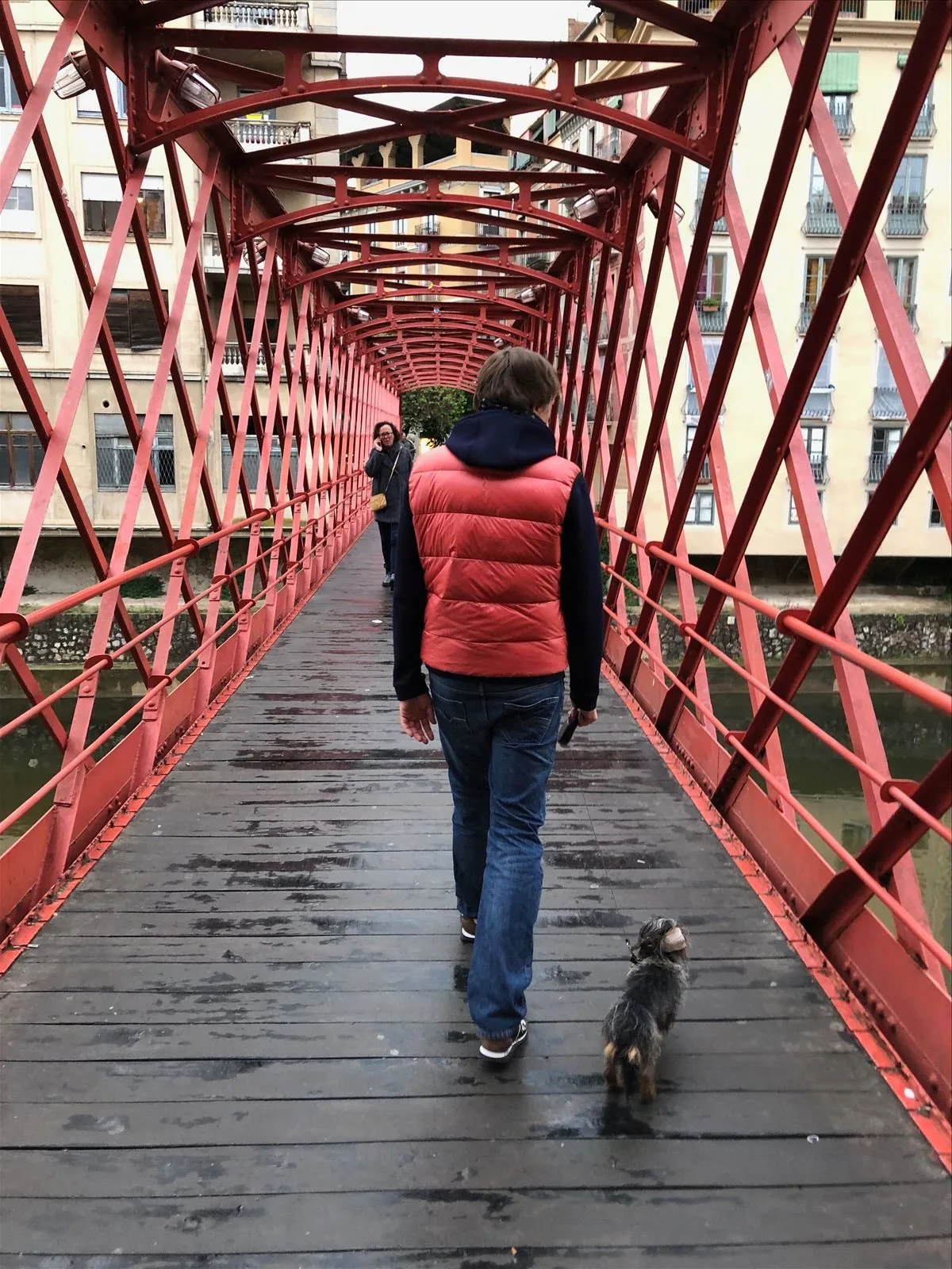 Woman walking on Eiffel Bridge in Girona