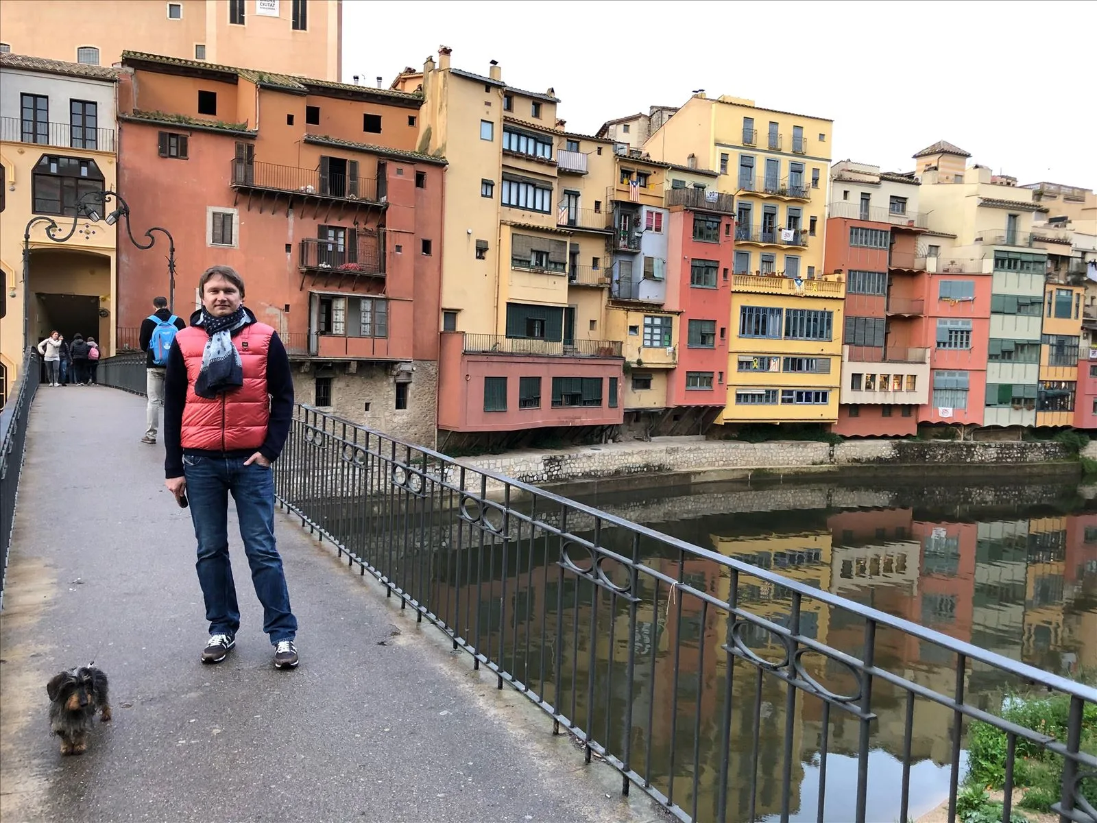 Colorful houses of Onyar — red Eiffel bridge