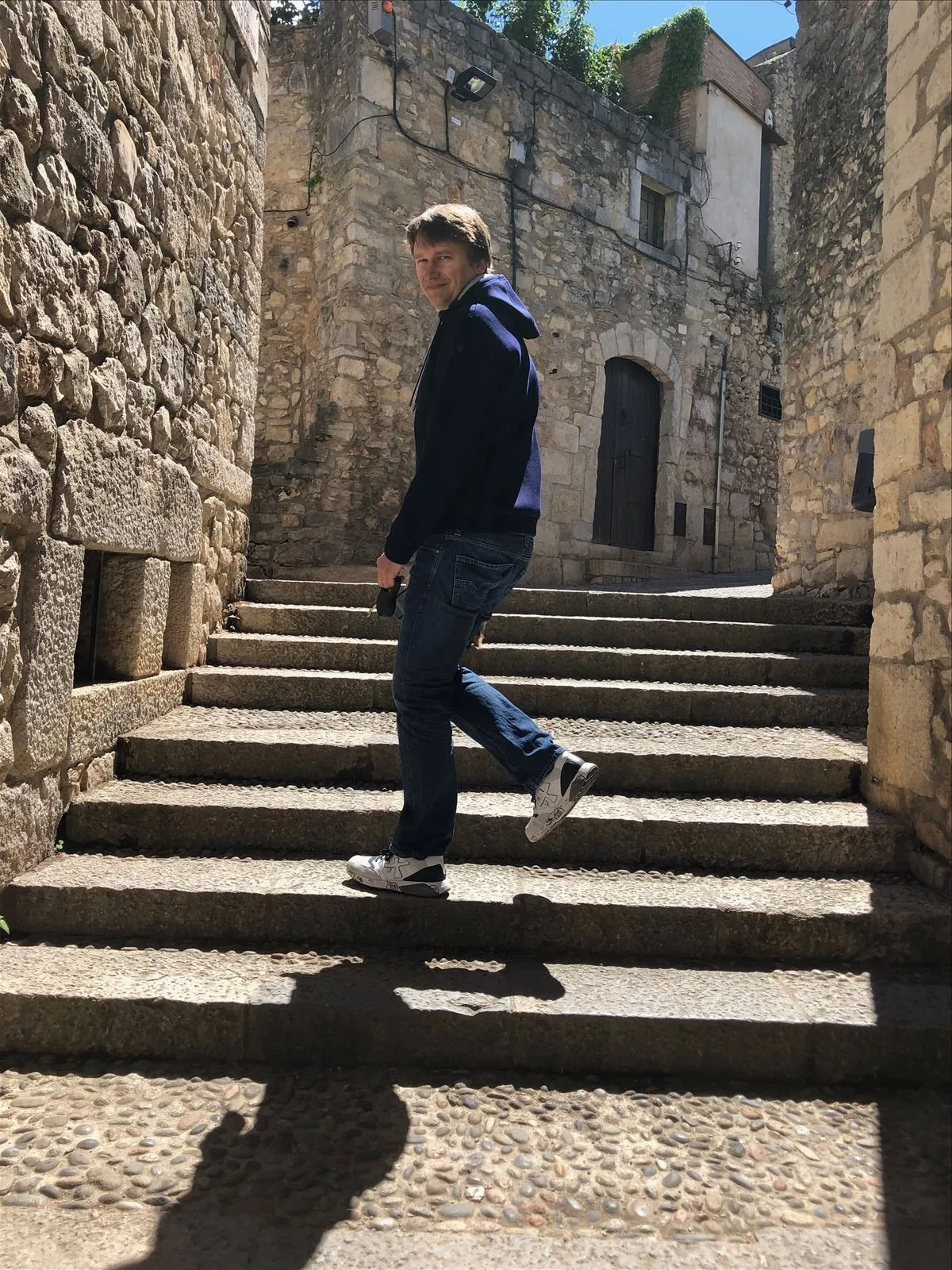 Man on stone steps in Girona