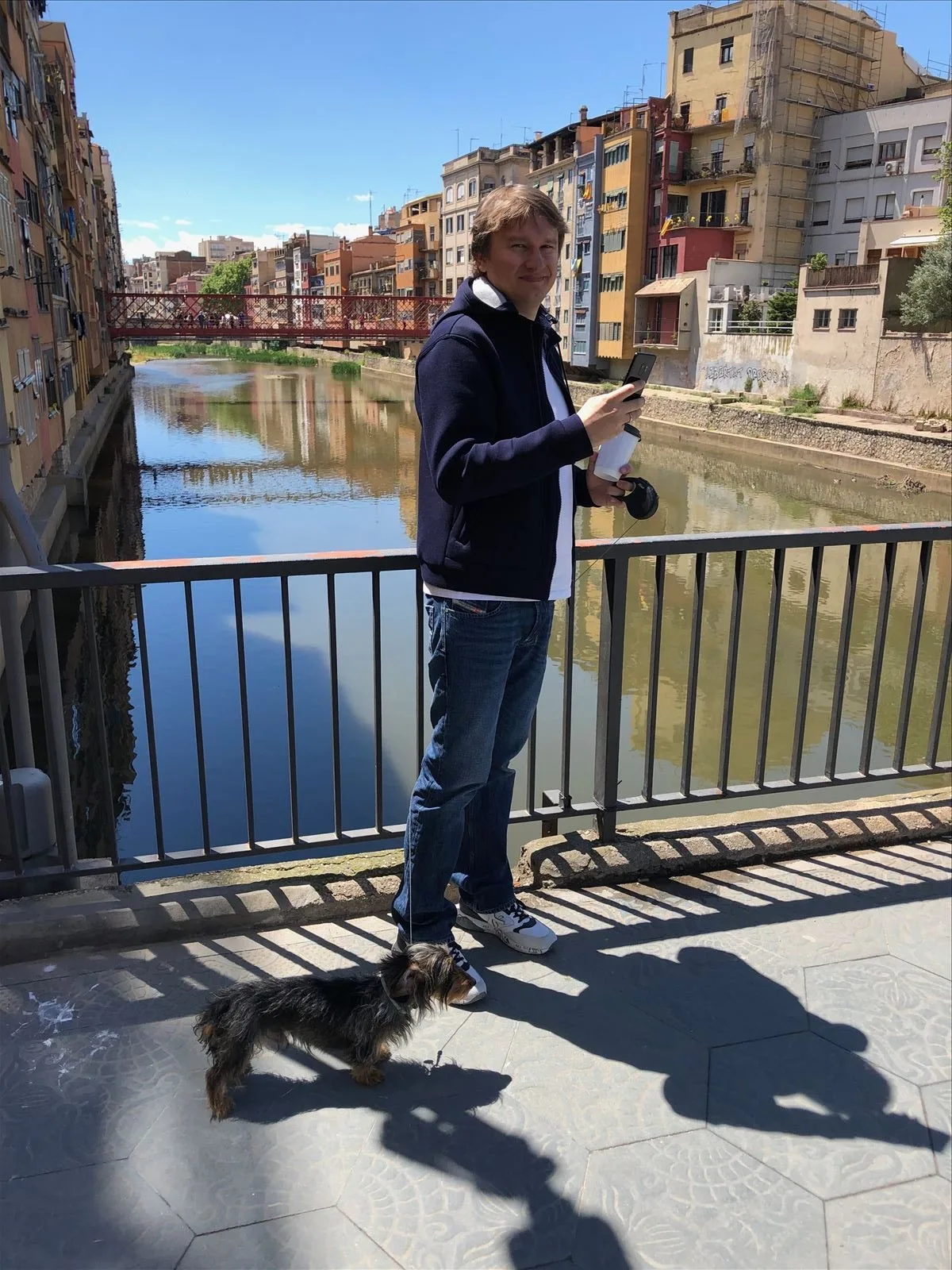 Man photographing from bridge in Girona