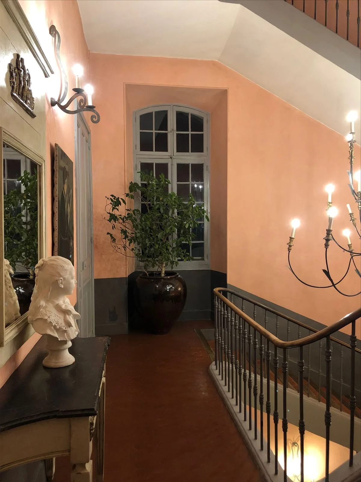 Balustrade and chandelier in chateau interior