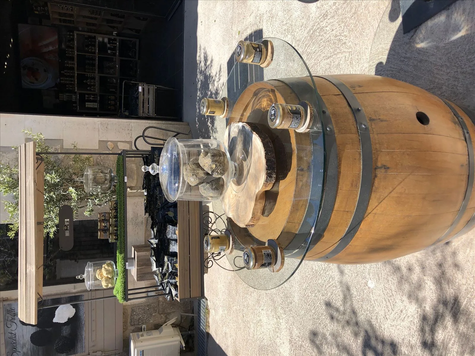 Wooden barrel by the stone wall of Provence