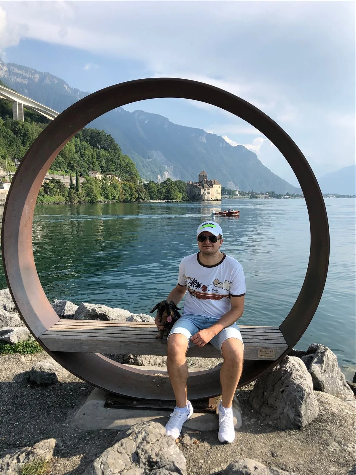View of the lake through a round sculpture