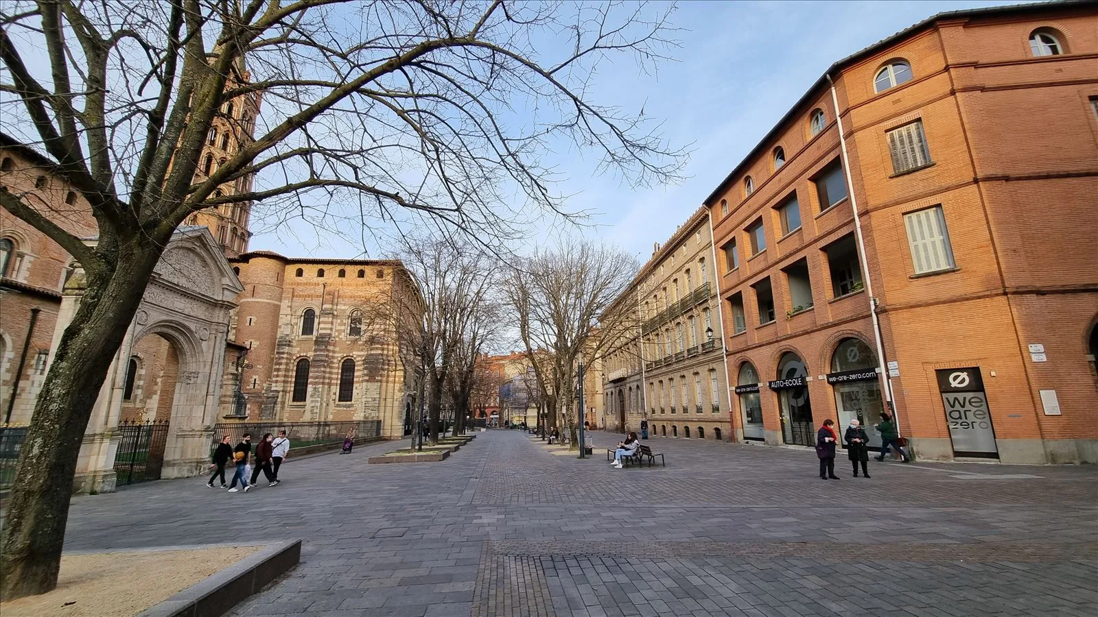 Wide street in Toulouse with pink facade