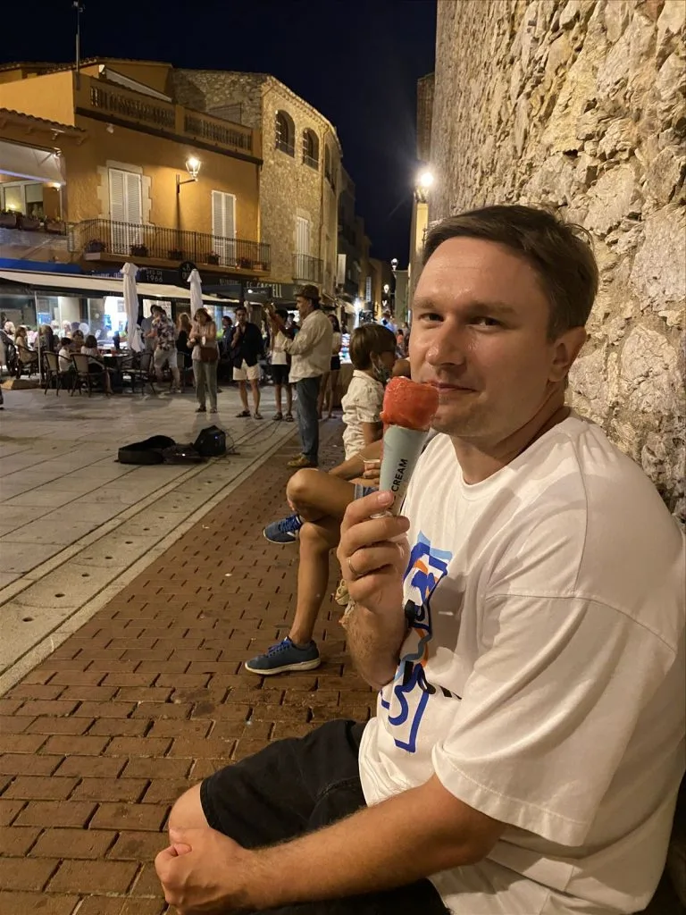 Woman with ice cream by the waterfront