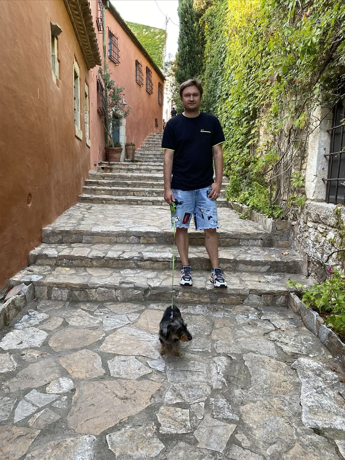 Man walking up steps in Begur