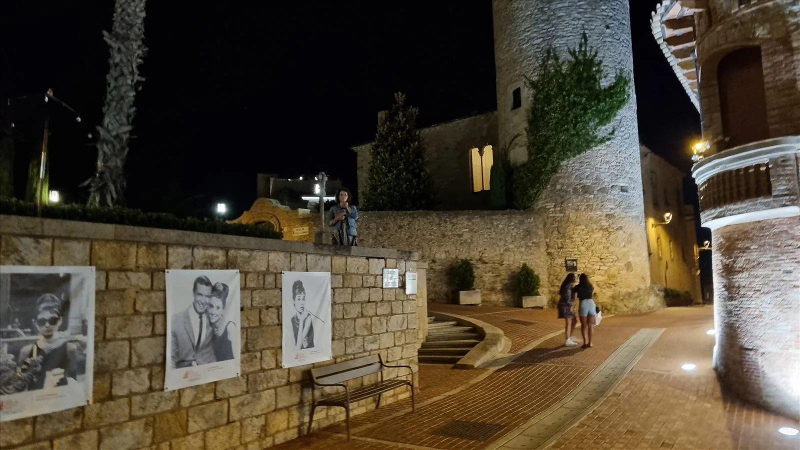 Ancient street of Begur with tourists