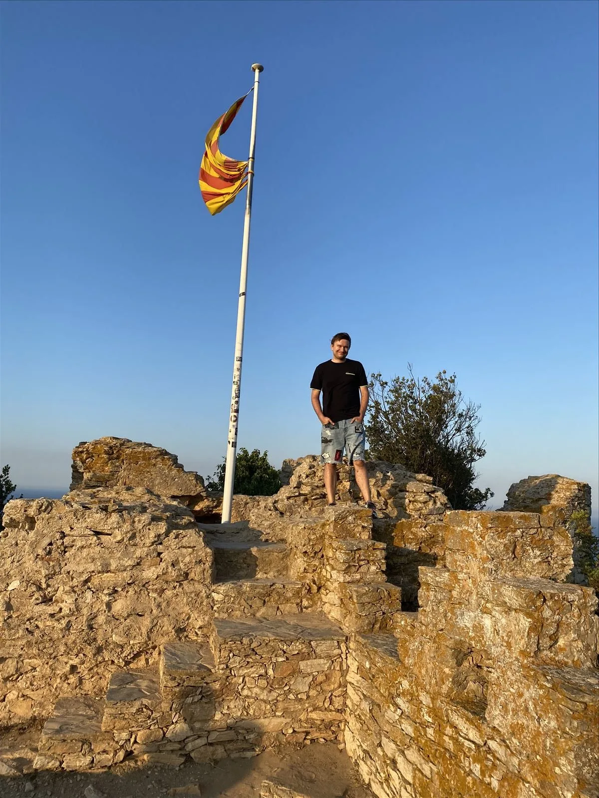 Man by Castel de Begur tower