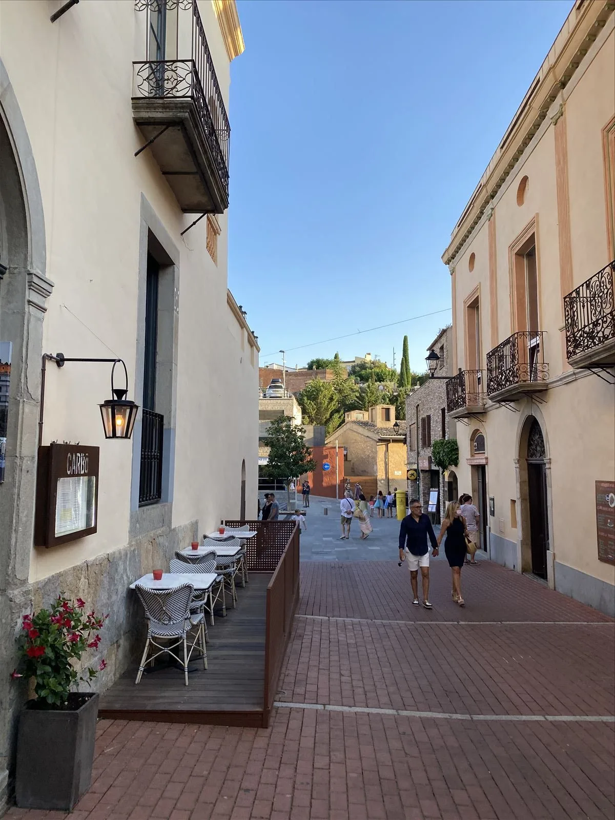Evening street of old Begur with cafes