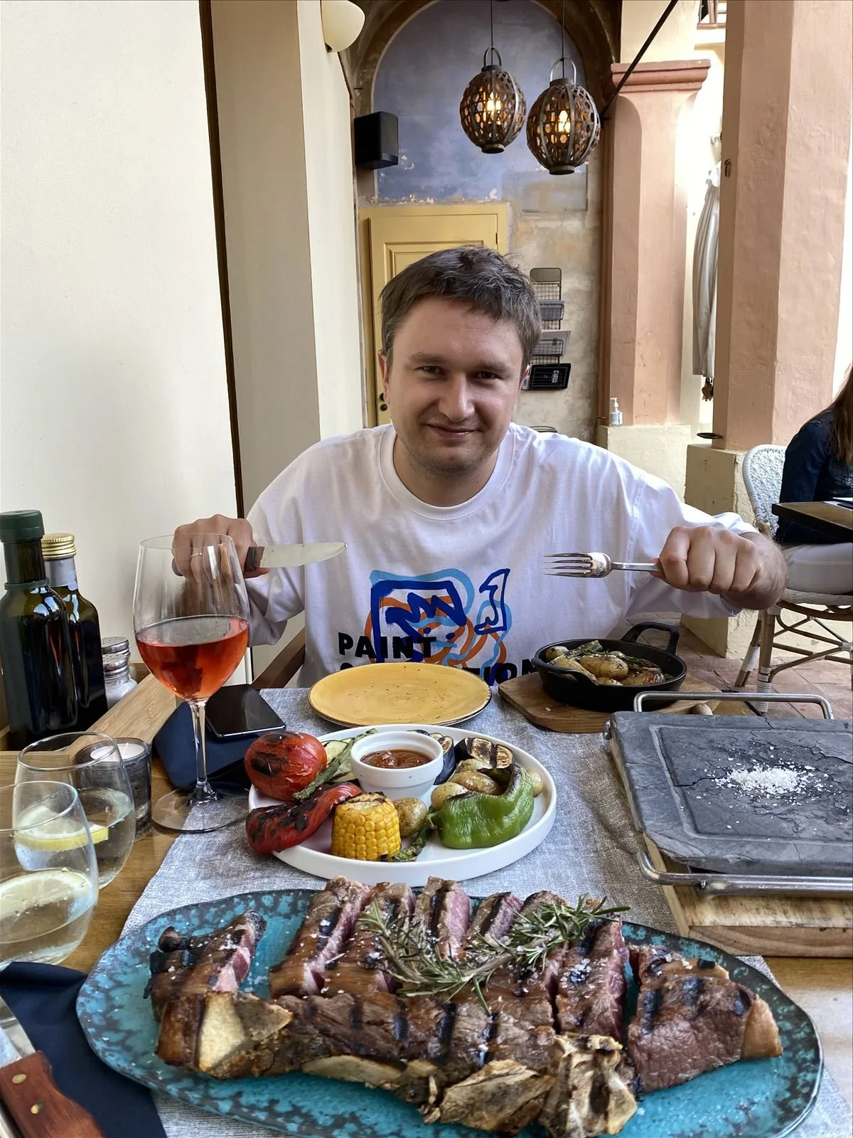 Man with cocktail in Begur restaurant