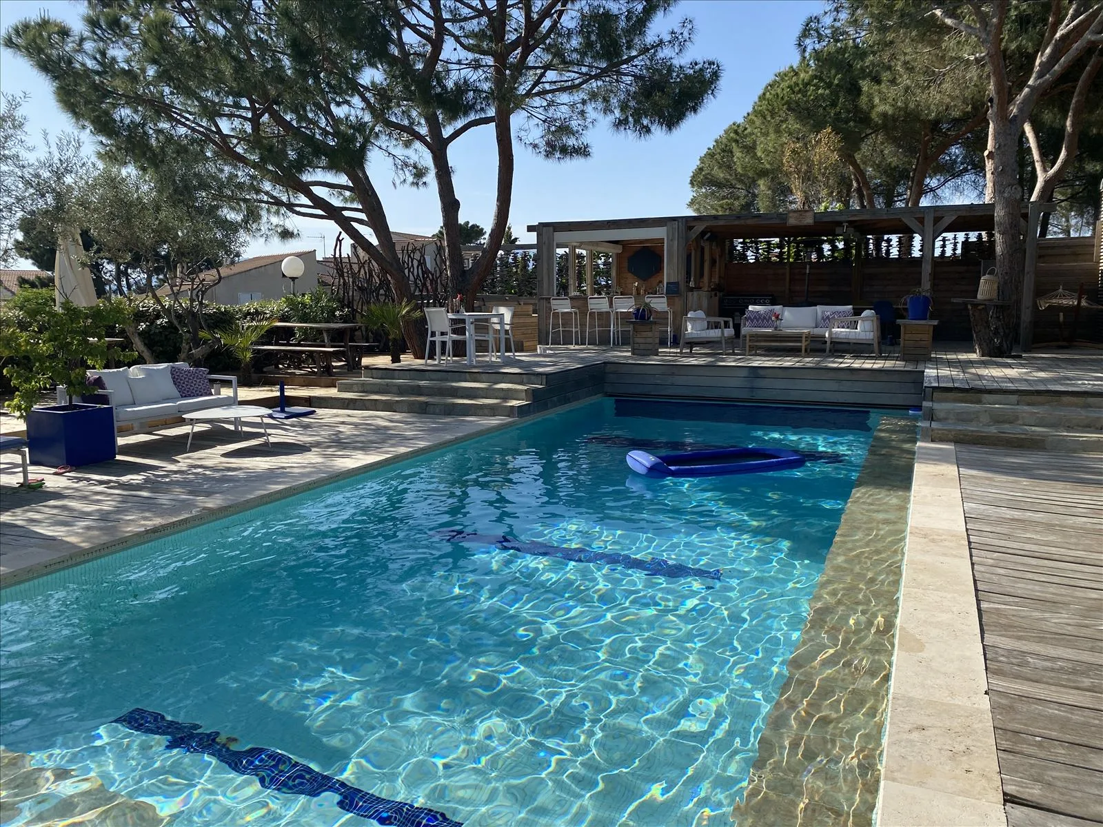 Pool with loungers at hotel in Corsica