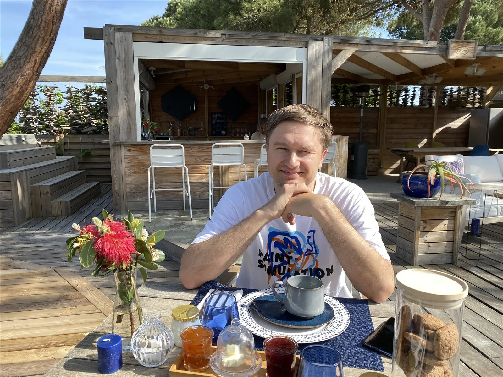 Woman having breakfast on the hotel terrace