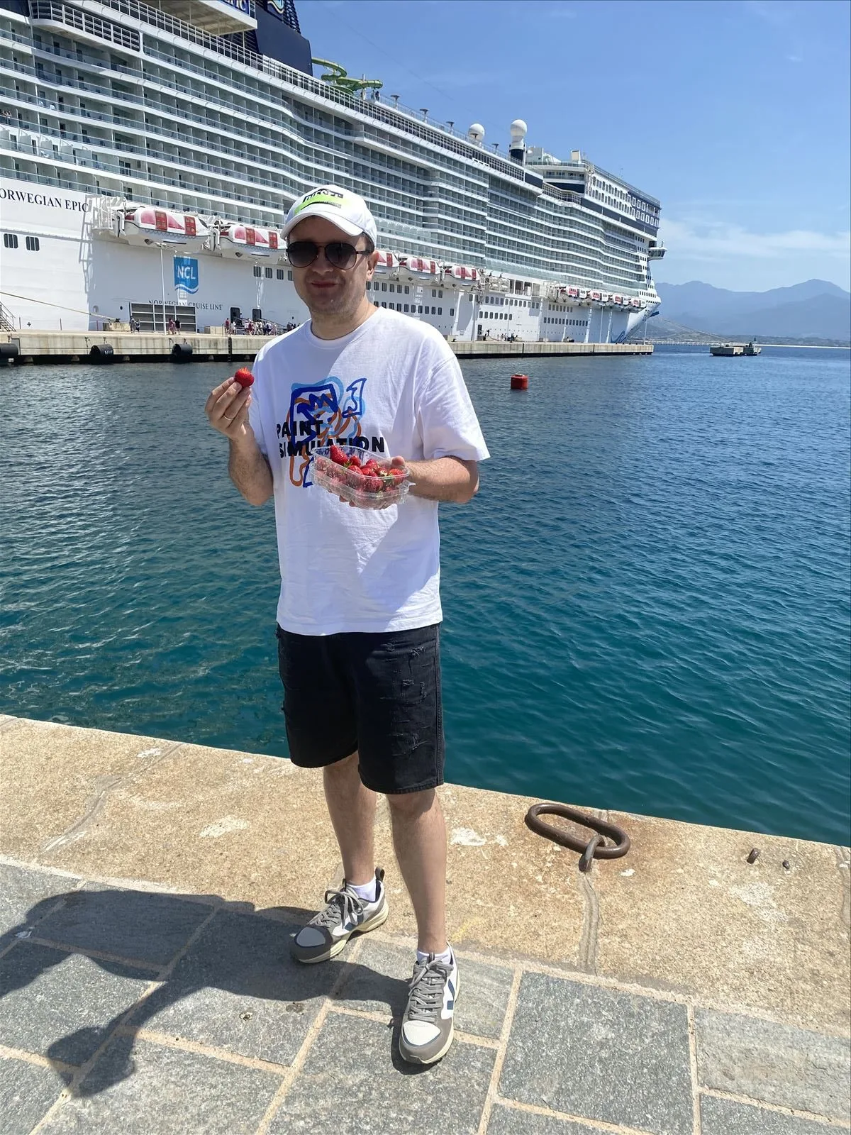 Man with water bottle on promenade