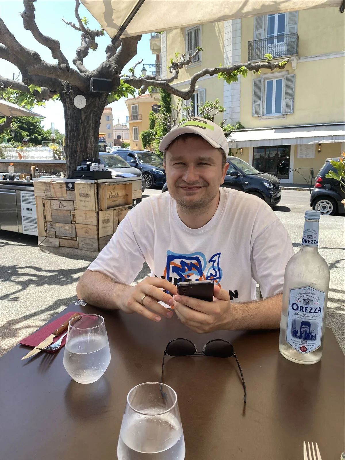 Man with local drink on Ajaccio street